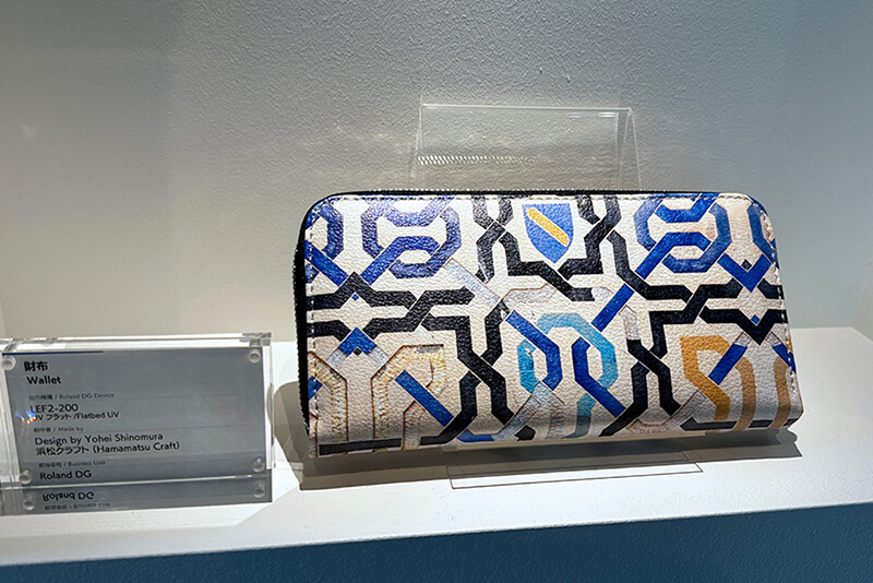 A custom-printed wallet displayed at the Roland DG headquarters' exhibition space